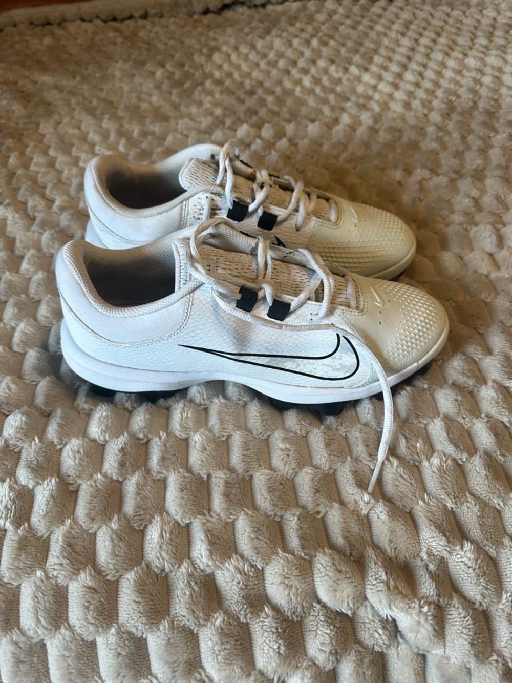 Nike White and black Cleats with Black Swoosh women’s size 9.5